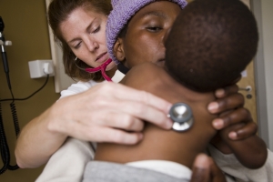 Dr. Teresa Frits examining a patient at the COE in Maseru, Lesotho