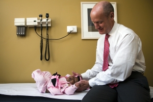 Dr. Mark Kline examining a young patient at the BIPAI center in Lesotho